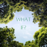 "What if?" in the middle of a blue sky with trees around it. Perspective taken from the ground looking up.